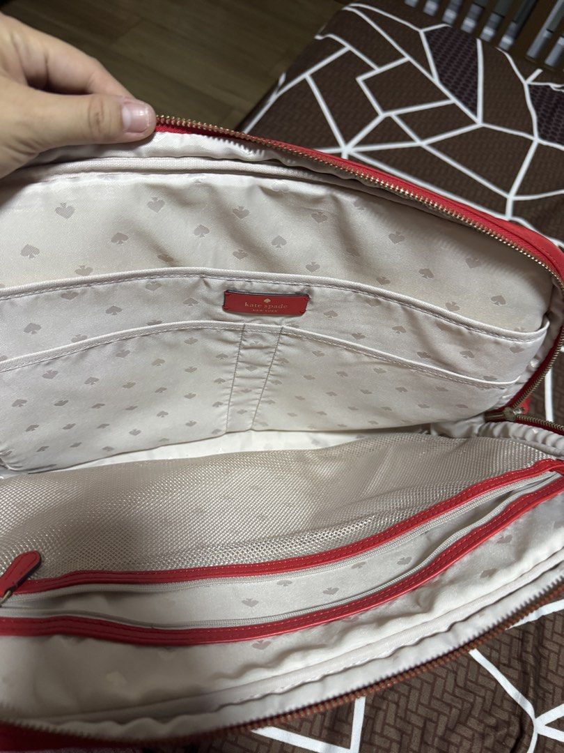 Kate Spade Red Nylon Messenger Bag (Category: Luxury Bags & Wallets) located in Pasig City. Submitted by goodfindsmomma (Listing ID 1447052200, Image 2). Description: - Red Kate Spade laptop bag fits upto 15-18 inches laptop - Durable nylon material - Multiple interior pockets for organization - Main zip compartment - Front zip pocket - Adjustable strap - Ideal for everyday use or travel.