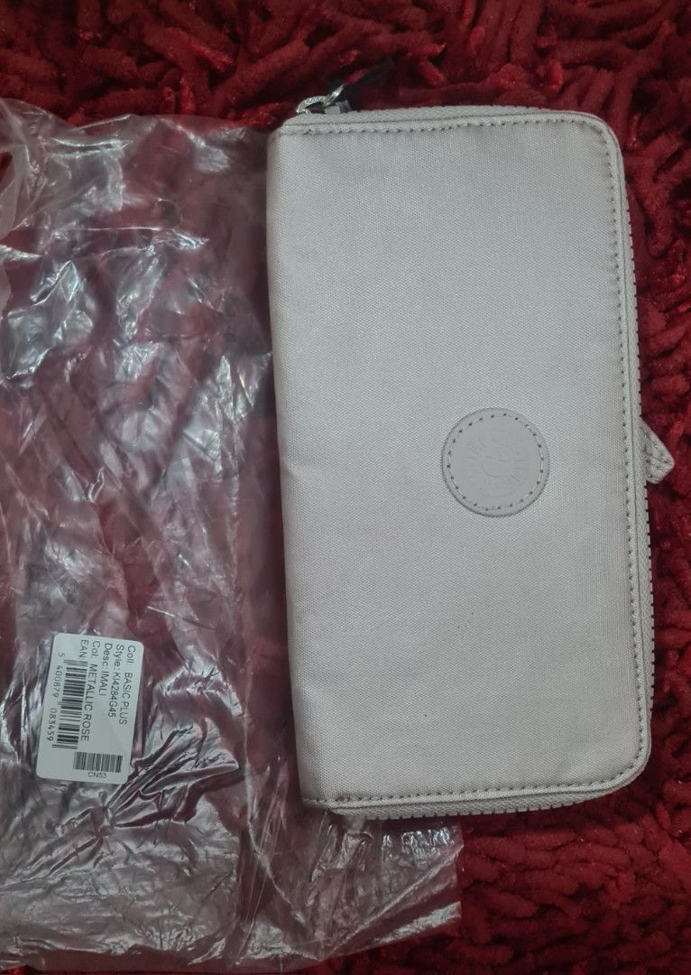 Kipling Basic Wallet Rose Gold (Category: Wallets & Card holders) located in Paranaque City. Submitted by lorem45 (Listing ID 1447020608, Image 1). Description: - Brand new Kipling wallet - Elegant rose gold color - Secure zip-around closure - Ample card slots and compartments for organization - Convenient wrist strap included - Still in original packaging - Ideal for keeping your essentials tidy and accessible.