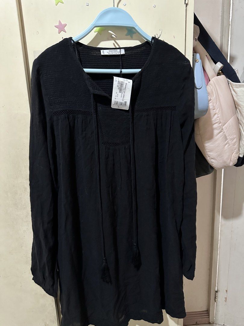 Mango Black Long Sleeve Tunic Top with Tassels (Category: Blouses) located in Davao. Submitted by gentledeer_36a645 (Listing ID 1446990635, Image 2). Description: - Brand: Mango - Color: Black - Style: Long sleeve top - Features: Smocked bodice, neckline tie with tassels - Fabric: Lightweight and flowy - Occasion: Casual wear - Size: S - Condition: Brand new with tags attached.