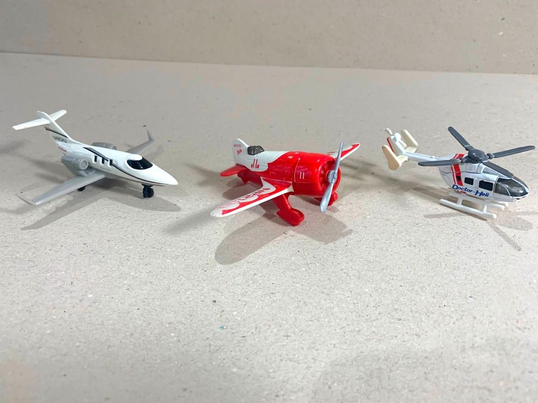 MBX and Tomy lot Skybusters (Category: Vehicle & Diecast Models) located in Mandaue City. Submitted by maxguiller89260 (Listing ID 1447014120, Image 1). Description: Takara Tomy Tomica No. 97 Doctor Helo. White and red die-cast metal body. Kawasaki BK117 D-3 air ambulance helicopter. Bending marks on rotors , otherwise intact slightly bent. Sticker markings on the rotor are missing. Sky Busters MBX/Matchbox aircraft Series Die-cast model of Gee B