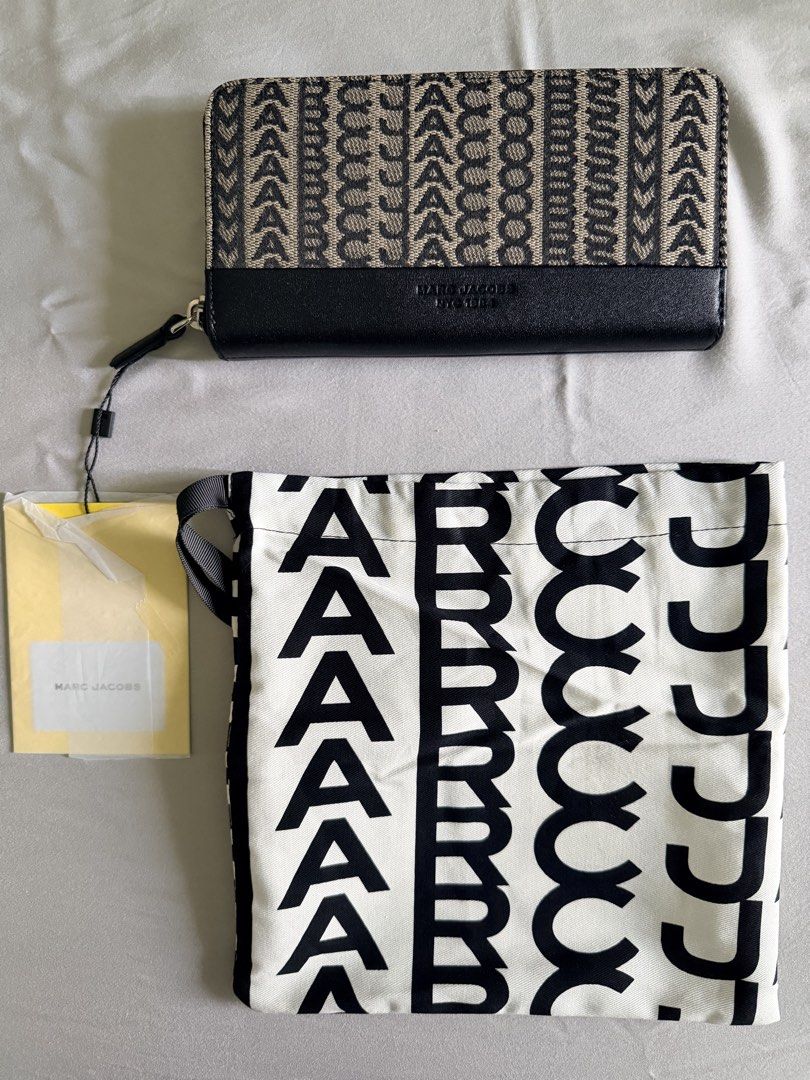 Monogram Zip Around Wallet with Pouch (Category: Luxury Bags & Wallets) located in Marikina City. Submitted by teacher.maria (Listing ID 1446952232, Image 1). Description: - Authentic Marc Jacobs zip-around wallet - Features the iconic all-over MJ monogram pattern - Comes with a matching drawstring pouch - Includes original tags and packaging - Ideal for organizing your daily essentials Monogram logo branding brings chic brand loyalty to this zip