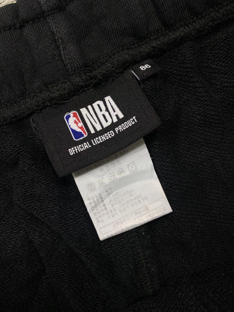 NBA New York Knicks Black Sweatpants (Category: Joggers) located in Cebu City. Submitted by theloose.thread (Listing ID 1447075314, Image 3). Description: - Official NBA licensed New York Knicks sweatpants - Size 34 (fits waist 86-109 cm) - Made from 100% soft cotton - Features a cool Knicks graphic on the side - Ideal for casual outings or relaxing at home - Care instructions: Hand wash with wool detergent.
