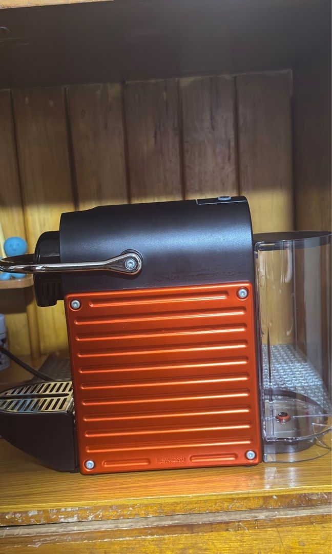Nespresso Pixie and pod organizer (Category: Coffee Machines & Makers) located in Mandaluyong City. Submitted by carou05062 (Listing ID 1446919941, Image 2). Description: Nespresso Pixie (Red) Free metal pod organizer, can hold up to six nespresso boxes Originally 16k, lightly used, pulls espresso good can send vid, no box.