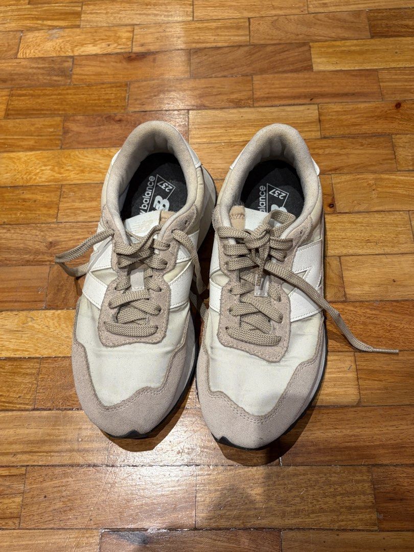 New Balance 237 Beige White Sneakers (Category: Sneakers) located in Manila. Submitted by preloved_tdc (Listing ID 1447072077, Image 1). Description: - New Balance 237 Sneakers - Color: Beige and White - Size: US 7 - Perfect for everyday wear - Comfortable and stylish design - Please check photos for detailed condition.
