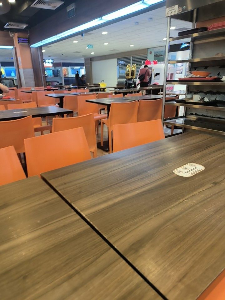 Orange Stackable Plastic Cafe Chairs (Category: Chairs) located in Singapore. Submitted by junaidahyahya (Listing ID 1446919607, Image 2). Description: - Set of bright orange plastic chairs - Ideal for cafes, restaurants, or outdoor seating - Durable and easy to stack - Vibrant, cheerful color - Stylish and functional choice for businesses.