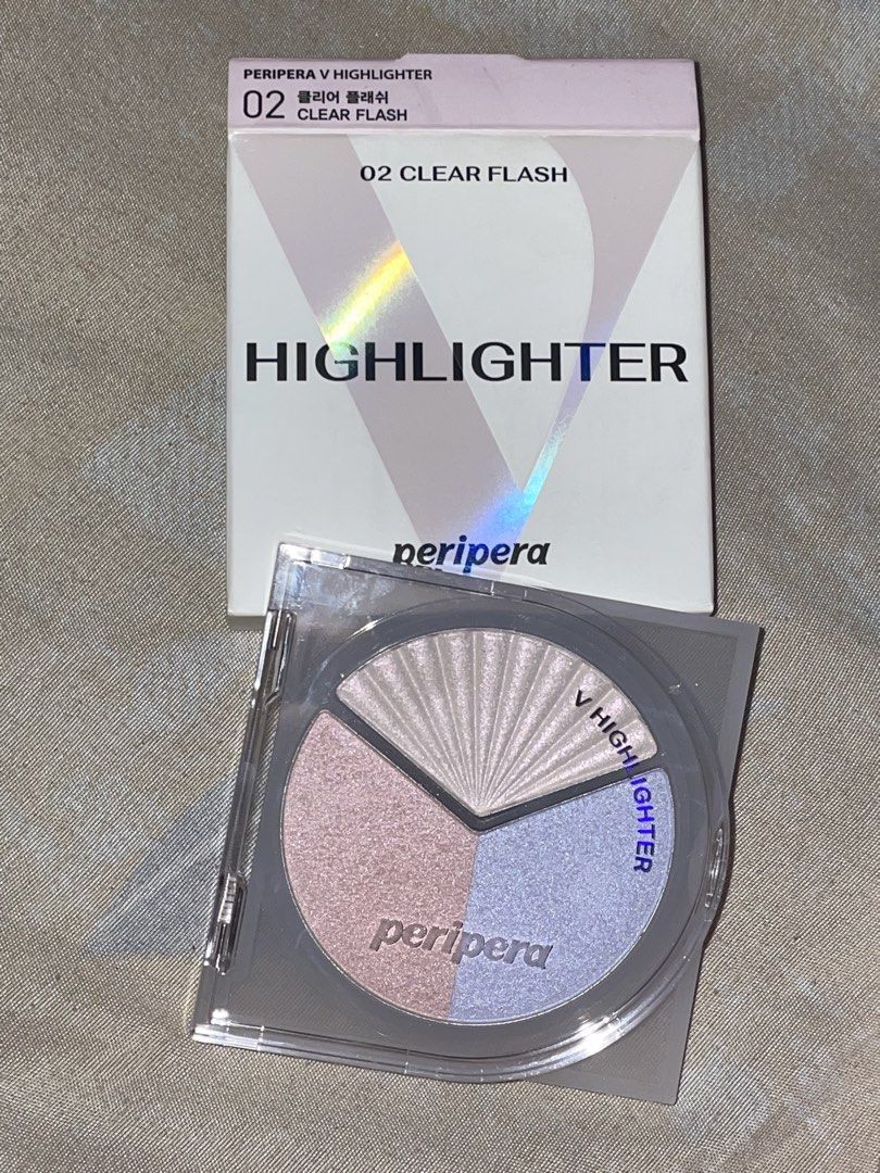 Peripera V Highlighter 02 Clear Flash Palette (Category: Makeup) located in Manila. Submitted by xoxocol (Listing ID 1446974234, Image 1). Description: - Peripera V Highlighter - Shade: 02 Clear Flash - Type: Tri-color highlighter palette - Shades included: Pearly white, soft pink, light blue - Effect: Adds a beautiful glow - Packaging: Very pretty - Expiry Date: 2028.09.10.