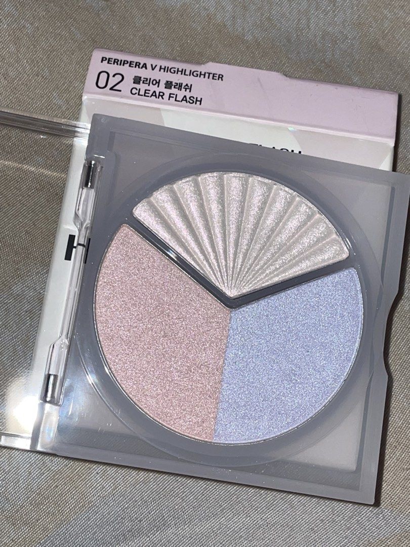 Peripera V Highlighter 02 Clear Flash Palette (Category: Makeup) located in Manila. Submitted by xoxocol (Listing ID 1446974234, Image 2). Description: - Peripera V Highlighter - Shade: 02 Clear Flash - Type: Tri-color highlighter palette - Shades included: Pearly white, soft pink, light blue - Effect: Adds a beautiful glow - Packaging: Very pretty - Expiry Date: 2028.09.10.