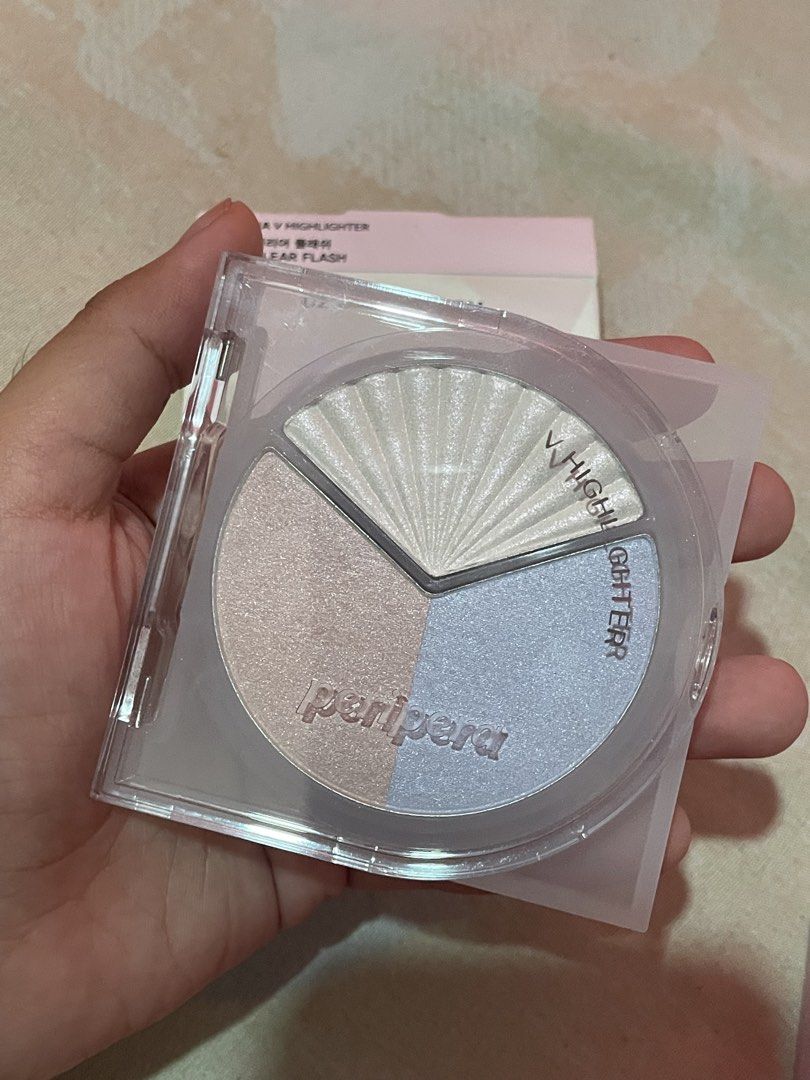 Peripera V Highlighter 02 Clear Flash Palette (Category: Makeup) located in Manila. Submitted by xoxocol (Listing ID 1446974234, Image 3). Description: - Peripera V Highlighter - Shade: 02 Clear Flash - Type: Tri-color highlighter palette - Shades included: Pearly white, soft pink, light blue - Effect: Adds a beautiful glow - Packaging: Very pretty - Expiry Date: 2028.09.10.