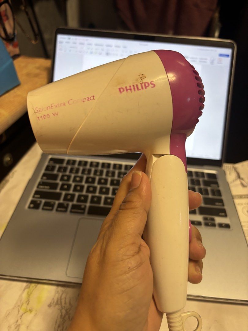 Philips SalonExtra Compact 1100W Hair Dryer (Category: Hair) located in Quezon City. Submitted by hi1811onlinemarket (Listing ID 1446955971, Image 1). Description: - Philips SalonExtra Compact Hair Dryer - 1100 Watts of Power - Color: White and Purple - Compact and Portable Design - Ideal for Travel or Everyday Use - Proven to Work Well.