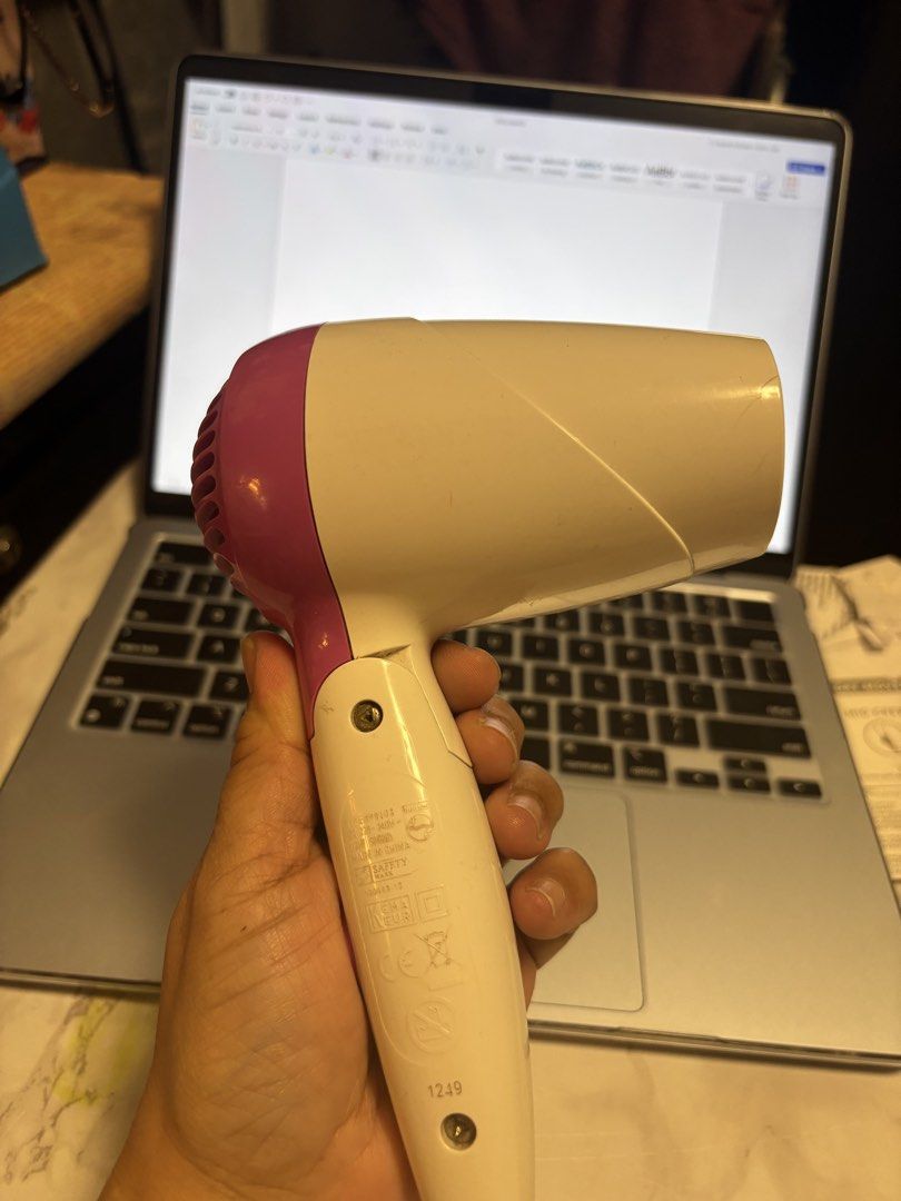Philips SalonExtra Compact 1100W Hair Dryer (Category: Hair) located in Quezon City. Submitted by hi1811onlinemarket (Listing ID 1446955971, Image 2). Description: - Philips SalonExtra Compact Hair Dryer - 1100 Watts of Power - Color: White and Purple - Compact and Portable Design - Ideal for Travel or Everyday Use - Proven to Work Well.
