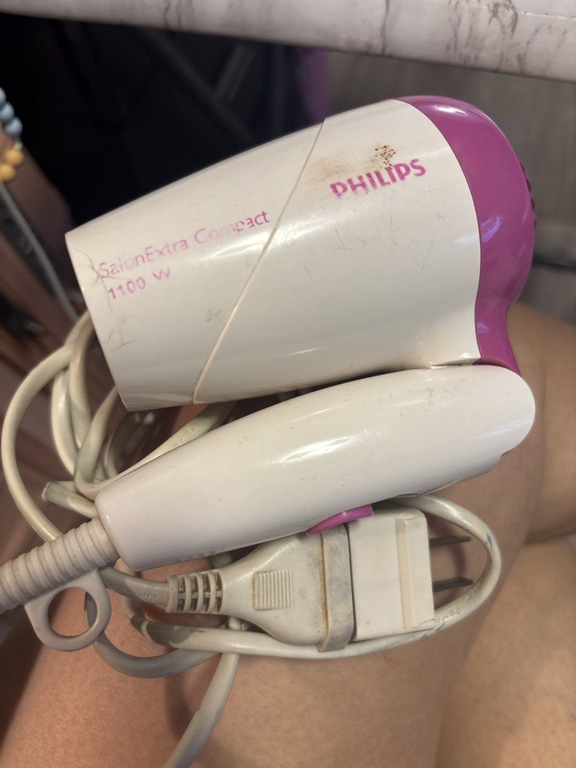 Philips SalonExtra Compact 1100W Hair Dryer (Category: Hair) located in Quezon City. Submitted by hi1811onlinemarket (Listing ID 1446955971, Image 3). Description: - Philips SalonExtra Compact Hair Dryer - 1100 Watts of Power - Color: White and Purple - Compact and Portable Design - Ideal for Travel or Everyday Use - Proven to Work Well.