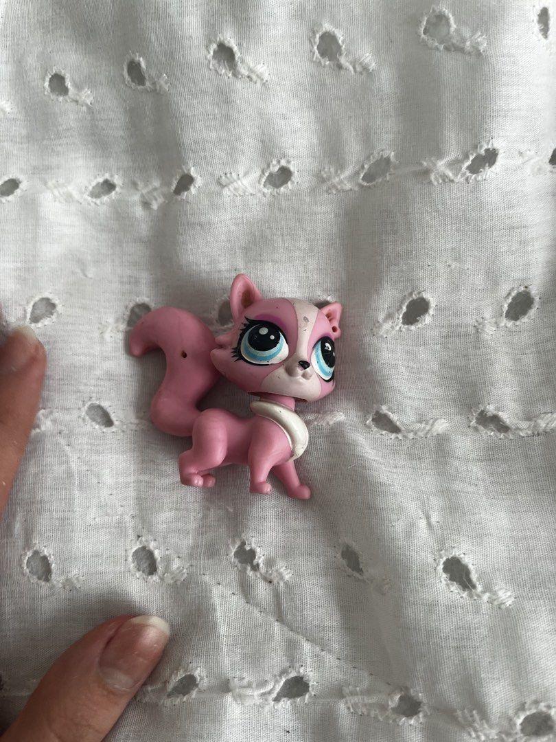 Pink Littlest Pet Shop Cat Figure (Category: Figurines & Statues) located in Manila. Submitted by sammiesellsstuff (Listing ID 1446964280, Image 1). Description: - Cute pink cat LPS toy - Features big blue eyes and a white collar - Tail has a slight bend - Small hole on the back of the body - Ideal for LPS collectors or playtime.