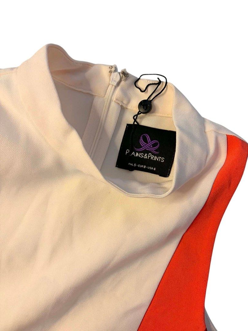 Plains & Prints Sleeveless Colorblock Top (Category: Sleeveless) located in Baguio. Submitted by gabriyelo (Listing ID 1447053775, Image 3). Description: - Sleeveless top from Plains & Prints - Cream base with orange and red colorblocking - High neckline - Zip closure at the back - Estimated size: S/M - Perfect for dressing up or down.