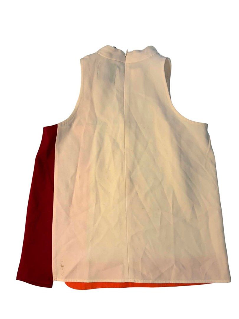 Plains & Prints Sleeveless Colorblock Top (Category: Sleeveless) located in Baguio. Submitted by gabriyelo (Listing ID 1447053775, Image 2). Description: - Sleeveless top from Plains & Prints - Cream base with orange and red colorblocking - High neckline - Zip closure at the back - Estimated size: S/M - Perfect for dressing up or down.