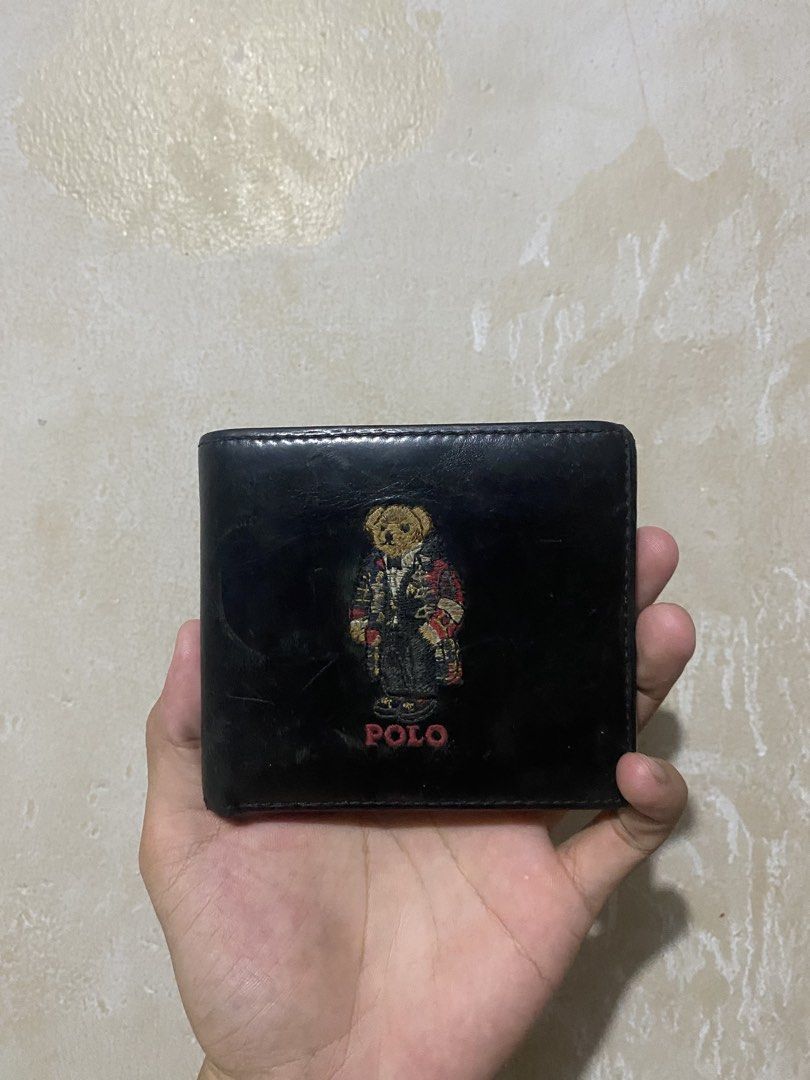 Polo Ralph Lauren Bear Bi-fold Wallet Black (Category: Wallets & Card holders) located in Manila. Submitted by nickoelmor72521 (Listing ID 1447022011, Image 1). Description: - Brand: Polo Ralph Lauren - Color: Black - Style: Bi-fold wallet - Material: Leather - Features: Iconic Polo Bear graphic on front, multiple card slots - Ideal for: Everyday use.