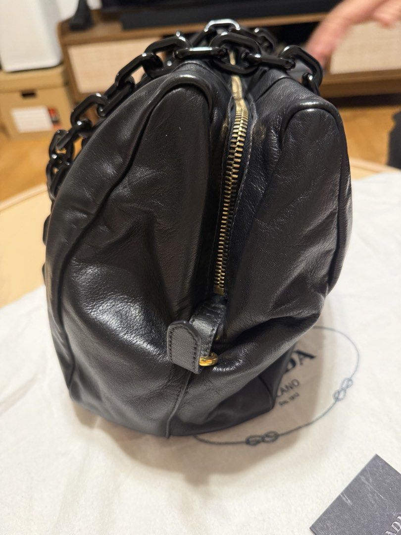 Prada Nappa Leather Chain Tote – Authentic (Category: Luxury Bags & Wallets) located in Makati City. Submitted by quert03 (Listing ID 1447049814, Image 3). Description: Elegant and stylish Prada leather shoulder bag crafted from soft black nappa leather with statement oversized resin chain handles. A timeless piece that easily transitions from casual to dressy. ✨ Details: * Authentic Prada * Soft black nappa leather * Oversized black resin chain 