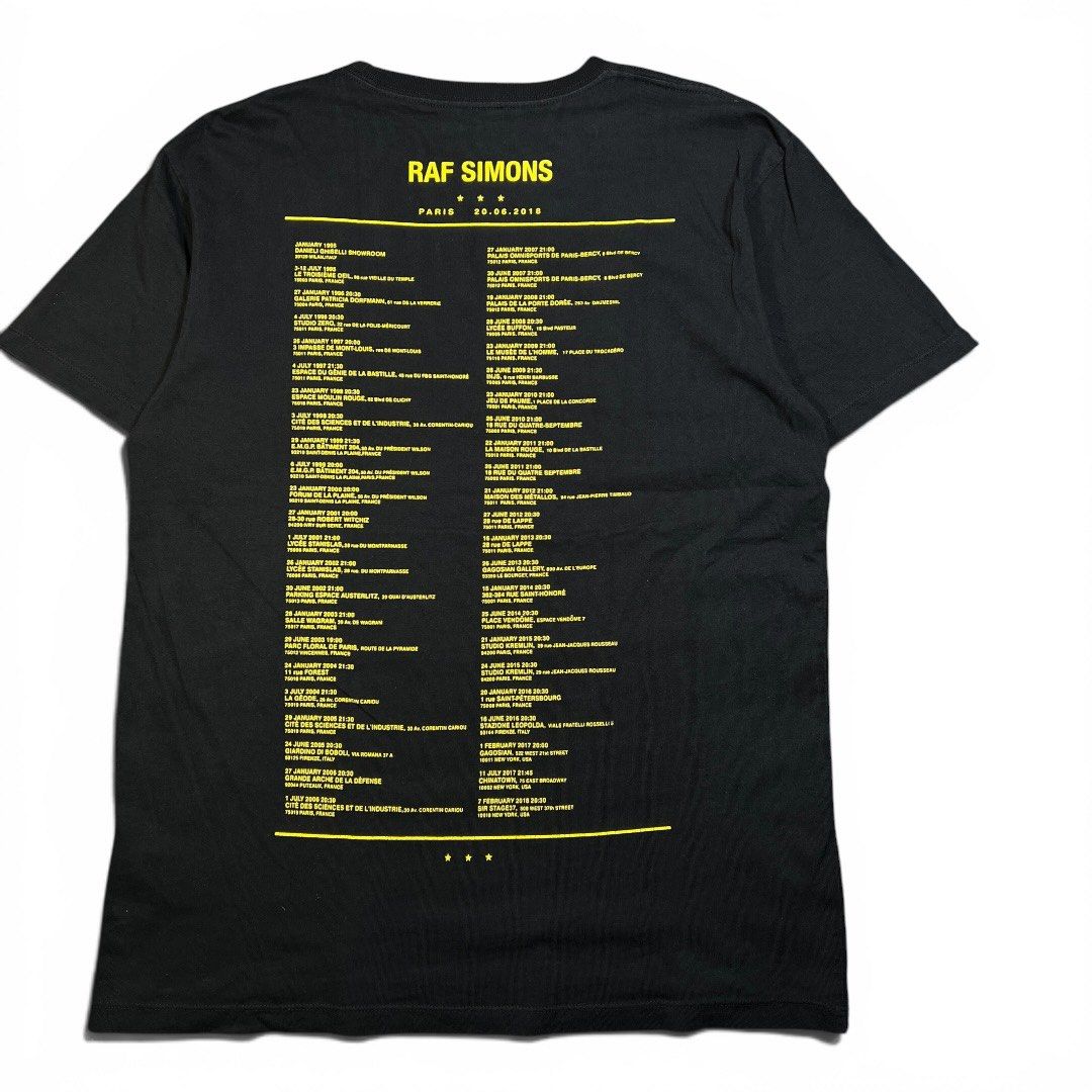 Raf Simons Paris Spring Summer 2019 T-Shirt (Category: Tshirts & Polo Shirts ) located in Batangas. Submitted by nthlgtthrifts. (Listing ID 1447067608, Image 2). Description: - Authentic Black Raf Simons T-Shirt - Spring/Summer 2019 Collection - Front features 'PARIS' and 'RAF SIMONS SPRING SUMMER 2019 93100 MONTREUIL' - Back lists tour dates and locations - Ideal for Raf Simons enthusiasts and collectors - Please check photos for condition detai