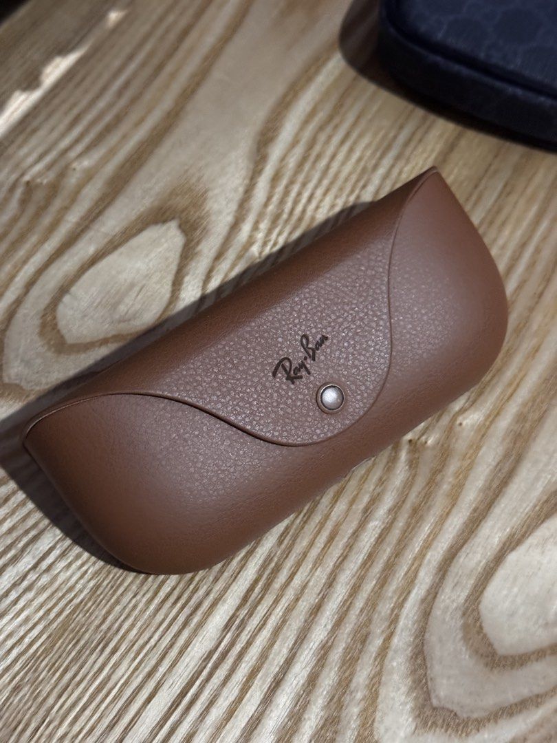 Ray-Ban Wayfarer Sunglasses with Case (Category: Sunglasses & Eyewear) located in Mandaluyong City. Submitted by gusteng (Listing ID 1447064635, Image 3). Description: - Classic Ray-Ban Wayfarer sunglasses - Stylish brown tortoise shell frame - Comes with original Ray-Ban case - Includes original Ray-Ban cleaning cloth - Perfect for everyday wear - Protect your eyes in style.
