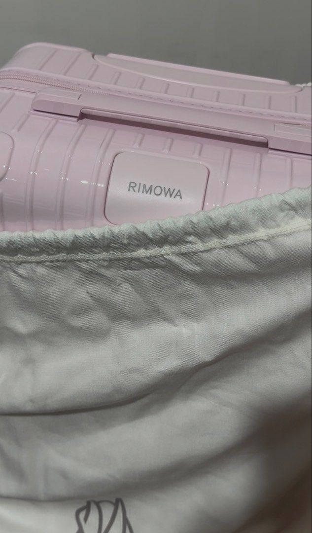 Rimowa Pink Cabin Suitcase (Category: Luggage) located in Quezon City. Submitted by minimalistmom7 (Listing ID 1446947381, Image 3). Description: - Pink Rimowa cabin size suitcase - Comes with original dust bag - Includes Rimowa shopping bag - Ideal for short trips - Feel free to ask any questions.