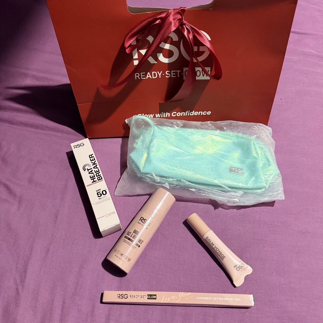 RSG Ready Set Glow Beauty Gift Set (Category: Face Care) located in Manila. Submitted by n_a_c (Listing ID 1446949814, Image 1). Description: - Complete RSG Ready-Set-Glow beauty set - Includes Badass Face & Body Mist - Heat Breaker Matte Serum Sunscreen SPF 50 - Statement Better Brow Duo - Comes with a cute iridescent makeup pouch - All items are authentic RSG products - Ideal for your skincare and makeup needs.
