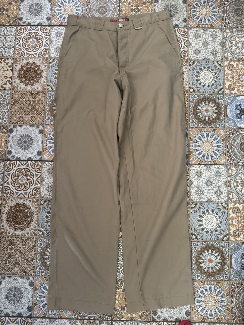 Stussy Work Pants Size 30 Khaki (Category: Jeans) located in Bacolod City. Submitted by darweenj (Listing ID 1446930669, Image 1). Description: - Stussy Khaki Work Pants - Size: 30 - Material: 60% Polyester, 40% Cotton - Closure: Button fly - Details: Stussy logo on button, Stussy NY/LA tag - Care: Wash dark colors separately - Ideal for: Everyday wear.