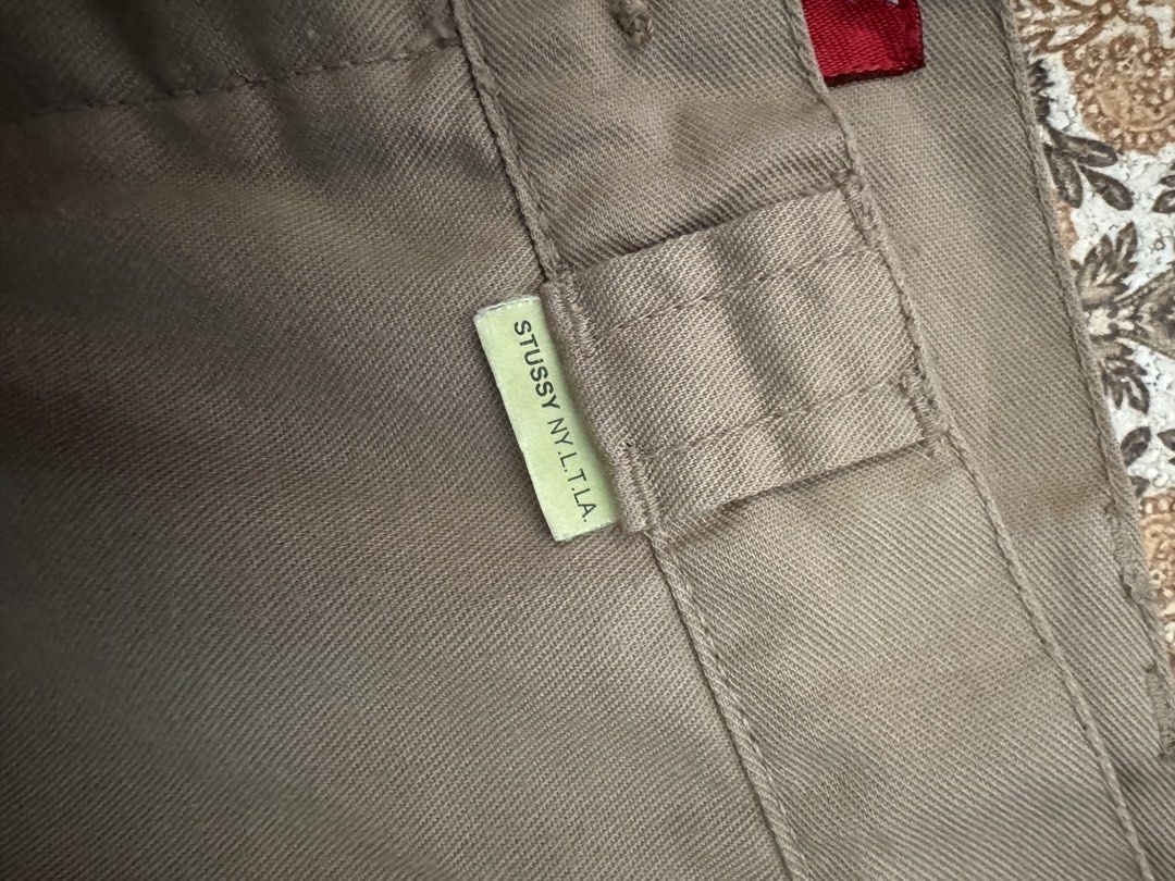 Stussy Work Pants Size 30 Khaki (Category: Jeans) located in Bacolod City. Submitted by darweenj (Listing ID 1446930669, Image 2). Description: - Stussy Khaki Work Pants - Size: 30 - Material: 60% Polyester, 40% Cotton - Closure: Button fly - Details: Stussy logo on button, Stussy NY/LA tag - Care: Wash dark colors separately - Ideal for: Everyday wear.