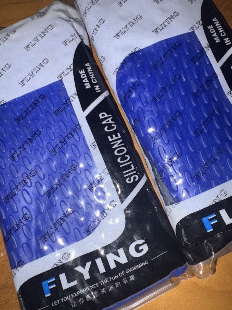 Swimming cap (Category: Water Sports) located in Singapore. Submitted by navybluedenimjeans (Listing ID 1447077458, Image 2). Description: - Set of 2 Flying silicone swimming caps - Color: Blue - Material: Silicone - Origin: Made in China.