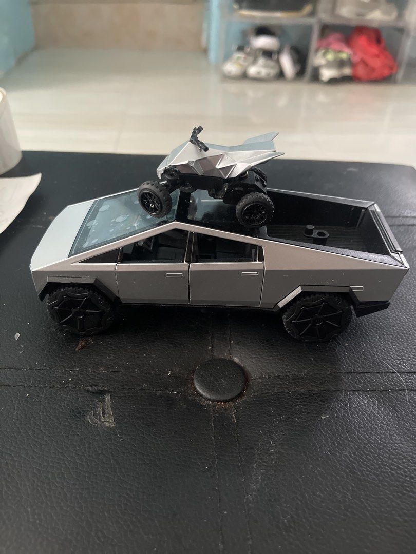 Tesla Cybertruck Toy with ATV (Category: Vehicle & Diecast Models) located in Maragondon. Submitted by whattodojustsell (Listing ID 1446921901, Image 2). Description: - Cool toy truck and ATV set - Truck features a detailed interior - ATV fits securely in the truck bed - Perfect for collectors and kids who love vehicles🥰 -like new battery still not use - heavyduty toy - diecast car.