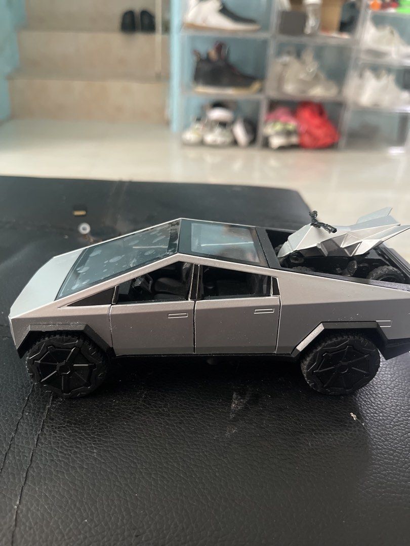 Tesla Cybertruck Toy with ATV (Category: Vehicle & Diecast Models) located in Maragondon. Submitted by whattodojustsell (Listing ID 1446921901, Image 1). Description: - Cool toy truck and ATV set - Truck features a detailed interior - ATV fits securely in the truck bed - Perfect for collectors and kids who love vehicles🥰 -like new battery still not use - heavyduty toy - diecast car.