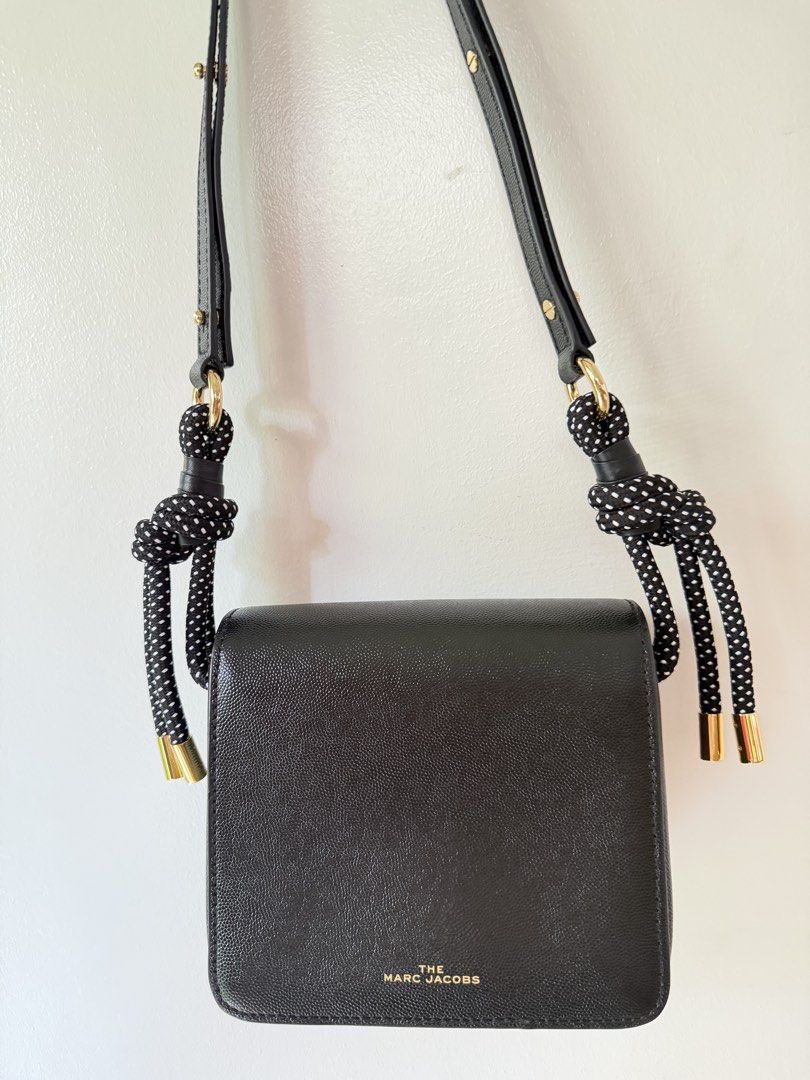 The Marc Jacobs Black Leather Snapshot Camera Bag (Category: Luxury Bags & Wallets) located in Paranaque City. Submitted by balofies (Listing ID 1446978790, Image 3). Description: The Marc Jacobs Snapshot Camera Bag 🖤 Used only twice and stored properly, so it’s in excellent condition. Crafted from black pebbled leather with the signature Marc Jacobs hardware. Features a unique adjustable shoulder strap with cute polka-dot knotted details. The b
