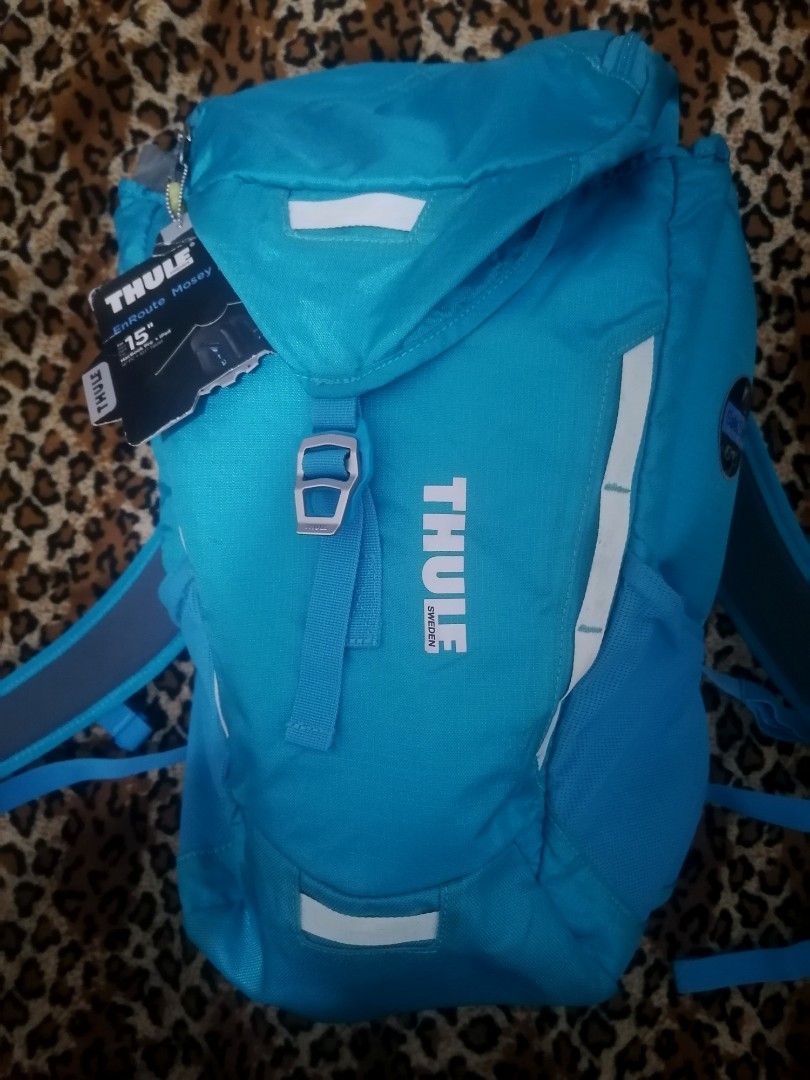Thule EnRoute Mosey 15" Laptop Backpack - Blue (Category: Backpacks) located in Cebu City. Submitted by roadthrift (Listing ID 1447104528, Image 2). Description: - Blue Thule backpack - Fits a 15" laptop - Features a SafeZone compartment - Ideal for school or day trips - Ample space for essentials - Reflective details for enhanced visibility - Comfortable shoulder straps.