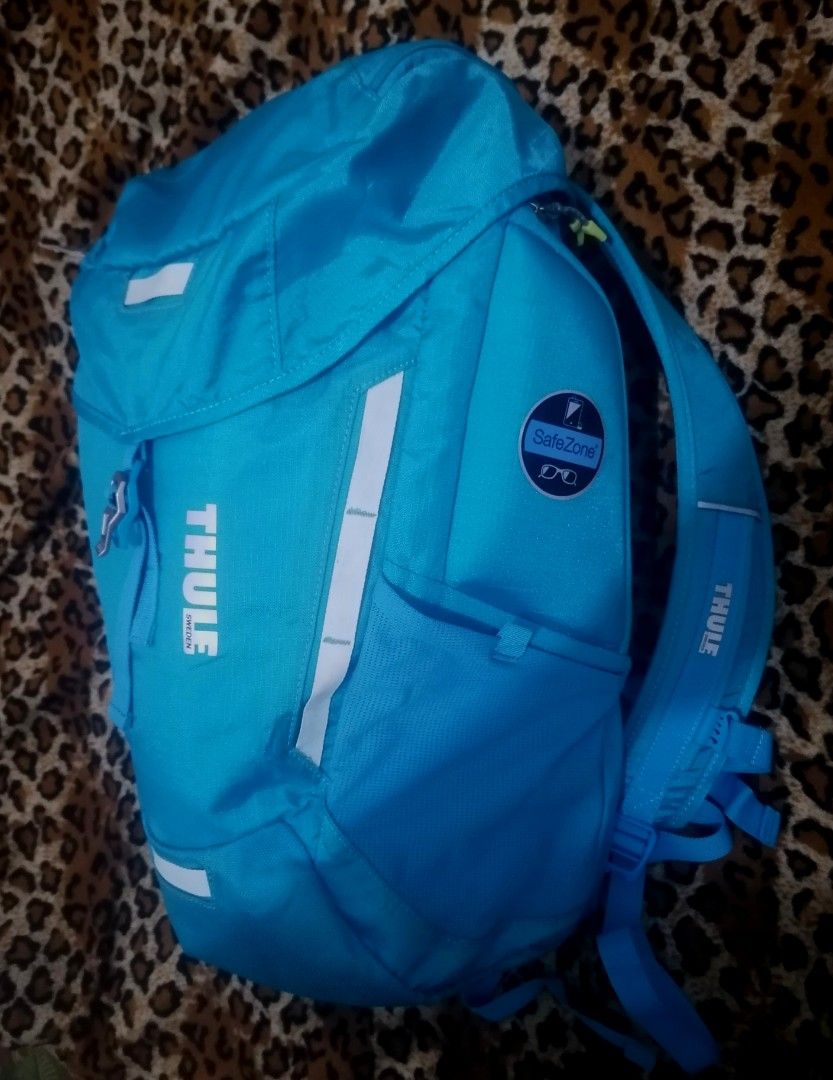 Thule EnRoute Mosey 15" Laptop Backpack - Blue (Category: Backpacks) located in Cebu City. Submitted by roadthrift (Listing ID 1447104528, Image 3). Description: - Blue Thule backpack - Fits a 15" laptop - Features a SafeZone compartment - Ideal for school or day trips - Ample space for essentials - Reflective details for enhanced visibility - Comfortable shoulder straps.