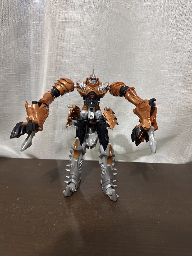 Transformers Grimlock Action Figure Toy (Category: Action & Battle Toys) located in Quezon City. Submitted by elektra0111 (Listing ID 1447100946, Image 1). Description: - Transformers Grimlock action figure - Features a cool robot and dinosaur-like appearance - Articulated limbs for dynamic posing - Perfect for Transformers fans, collectors, and kids - In good, pre-loved condition - 7 inches.