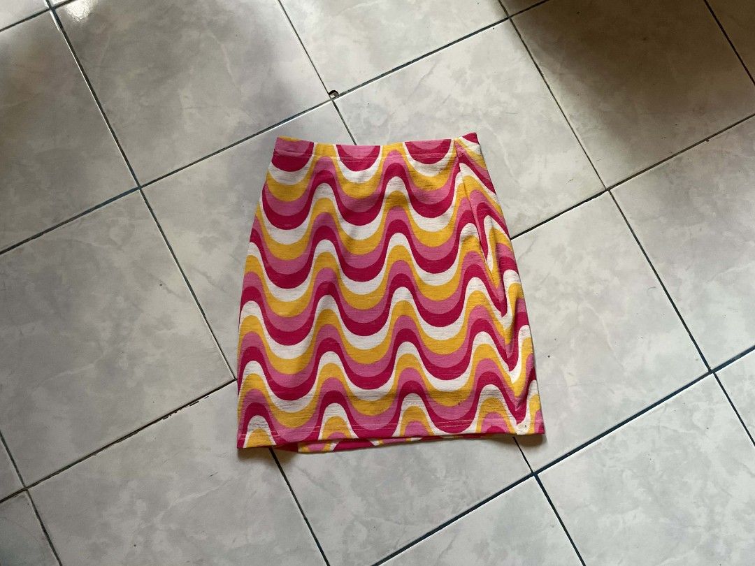 ASPACK Two Skirts: Plaid Pleated and Psychedelic Print Mini (Category: Skirts) located in Rosario. Submitted by tocus (Listing ID 1446966422, Image 2). Description: SHEIN SHIRTS - Tan plaid pleated skirt with detachable waist belt. - Fun pink, yellow, and white wavy print mini skirt. - Versatile pieces for casual outings or dressing up. - Unique additions to your wardrobe. - Grab them now!.