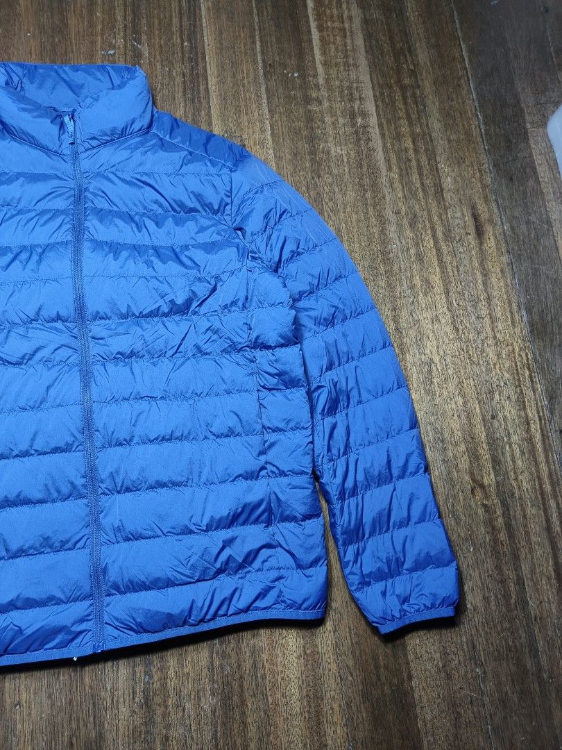 Uniqlo Lightweight Down Jacket Size L mens (Category: Coats, Jackets and Outerwear) located in Mandaluyong City. Submitted by heatgear (Listing ID 1447032612, Image 3). Description: missing pouch - Uniqlo Ultra Light Down Jacket - Color: Vibrant Blue - Size: Large (L) - Features water repellency - Ideal for layering or standalone wear - Packs down small for easy storage - Perfect for travel and everyday use - Made in China chest 96-104 cm height 