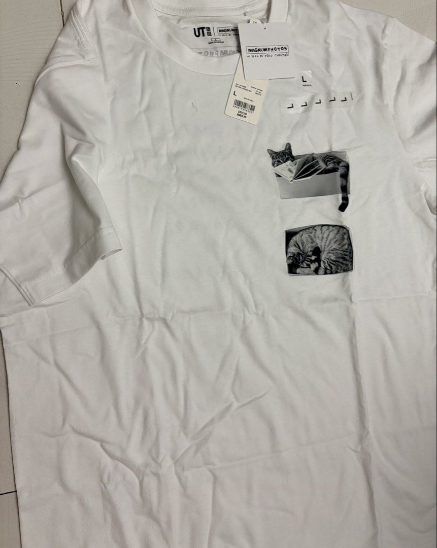 UNIQLO UT Magnum Photos Cat Graphic T-Shirt Size L (Category: Tshirts & Polo Shirts) located in Kuala Lumpur. Submitted by shashamochimi (Listing ID 1447014663, Image 3). Description: - Uniqlo UT T-shirt (BRAND NEW NEVER WORN) NP: RM59.90 - Magnum Photos Collaboration - White color - Features a graphic of cats in boxes on the front - Text detail on the back - Size: L - Ideal for cat lovers and photography fans.