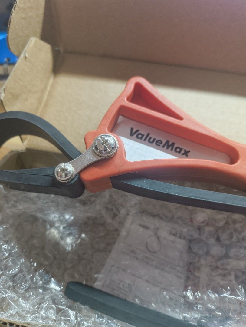 ValueMax Strap Wrench - Adjustable Rubber Strap Tool (Category: Construction Tools & Equipment) located in Pasig City. Submitted by x119362 (Listing ID 1446963329, Image 1). Description: - 6" ValueMax adjustable strap wrench - Features an adjustable rubber strap for versatile gripping - Orange and grey handle - Comes in its original box - Perfect for plumbing and automotive applications.