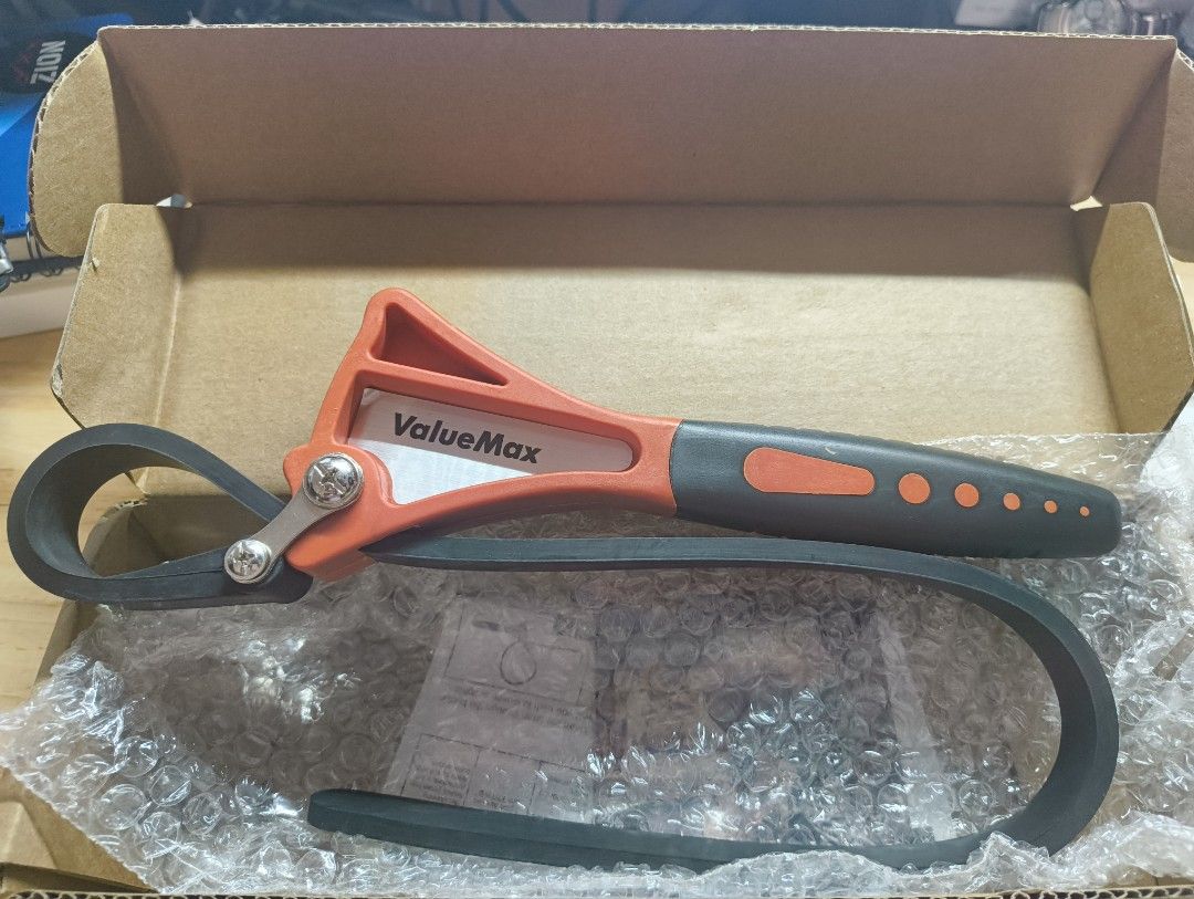 ValueMax Strap Wrench - Adjustable Rubber Strap Tool (Category: Construction Tools & Equipment) located in Pasig City. Submitted by x119362 (Listing ID 1446963329, Image 2). Description: - 6" ValueMax adjustable strap wrench - Features an adjustable rubber strap for versatile gripping - Orange and grey handle - Comes in its original box - Perfect for plumbing and automotive applications.