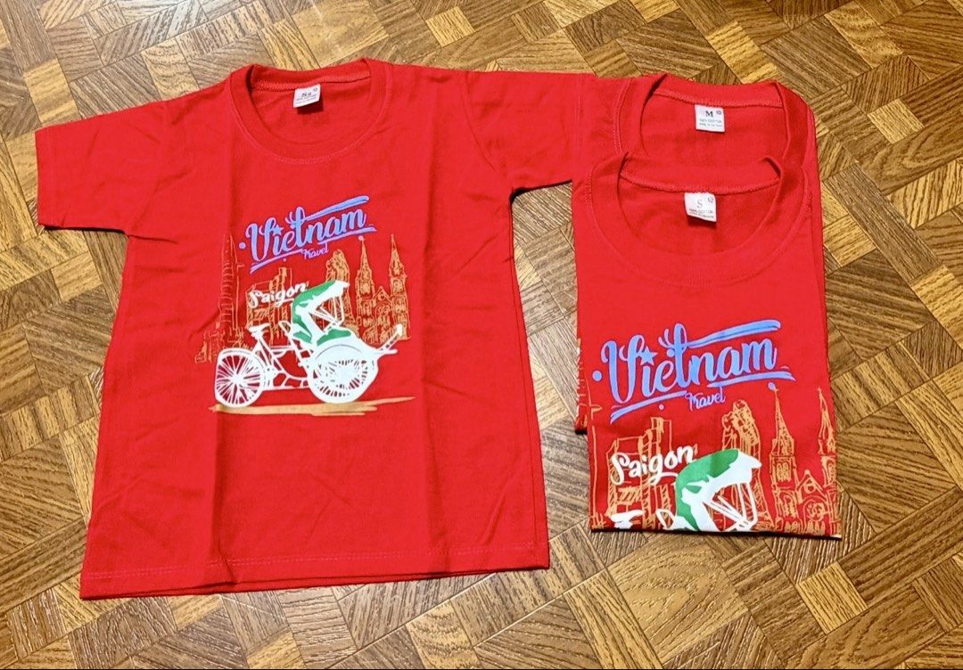 3pcs Vietnam Shirts for Family (Category: Shirts) located in Quezon City. Submitted by frappes (Listing ID 1446977309, Image 1). Description: 3pcs set for family (kids, small & medium) - Set of 2 red t-shirts with unique Vietnam travel design. - Features a classic Saigon cyclo graphic and city skyline. - Available sizes: 1 x Small (S), 1 x Medium (M). - Ideal for souvenirs or stylish casual wear. - Both shirts are in good, pre-loved condition..