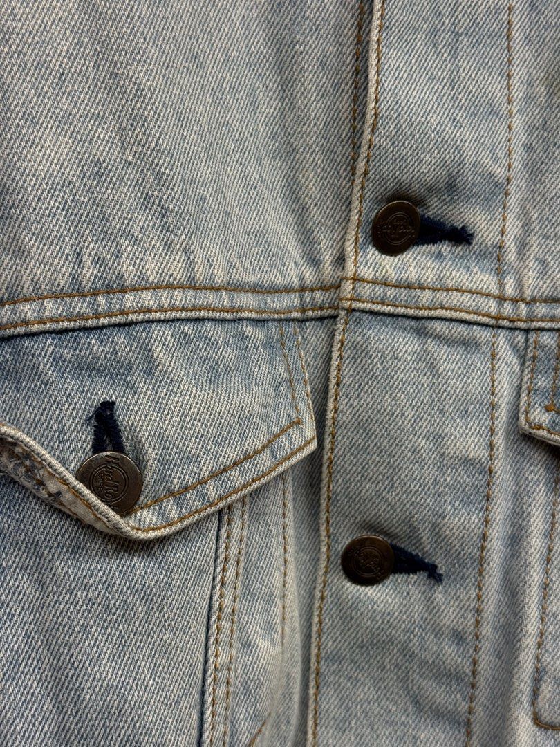 Vintage Hard Rock Cafe Denim Jacket (Category: Coats, Jackets and Outerwear) located in Legazpi City. Submitted by deadthrift (Listing ID 1447007874, Image 2). Description: - Classic light wash denim jacket - Dimensions: 22.5 | 25 - Features iconic Hard Rock Cafe logo patch - Made of 100% cotton - Button closure and chest pockets - Established 1971 - Dry clean only - A great staple piece for any wardrobe.