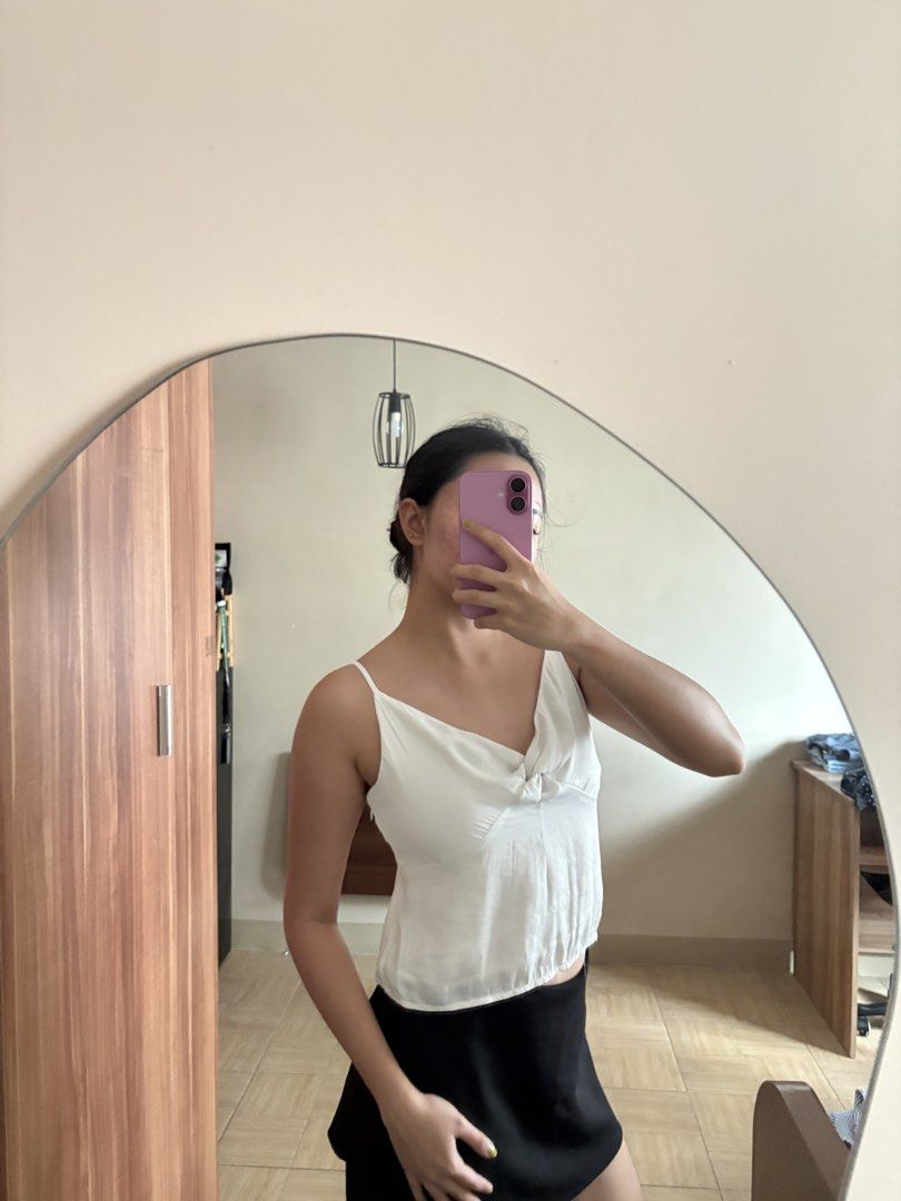 White Cami Top with Knot Detail (Category: Sleeveless) located in Manila. Submitted by _foryou (Listing ID 1446938052, Image 3). Description: - Cute white cami top - Features a stylish knot detail in the front - Delicate spaghetti straps - Lightweight and breathable, ideal for warm weather - Versatile: pairs perfectly with skirts or jeans - Easy to dress up or down for any occasion.