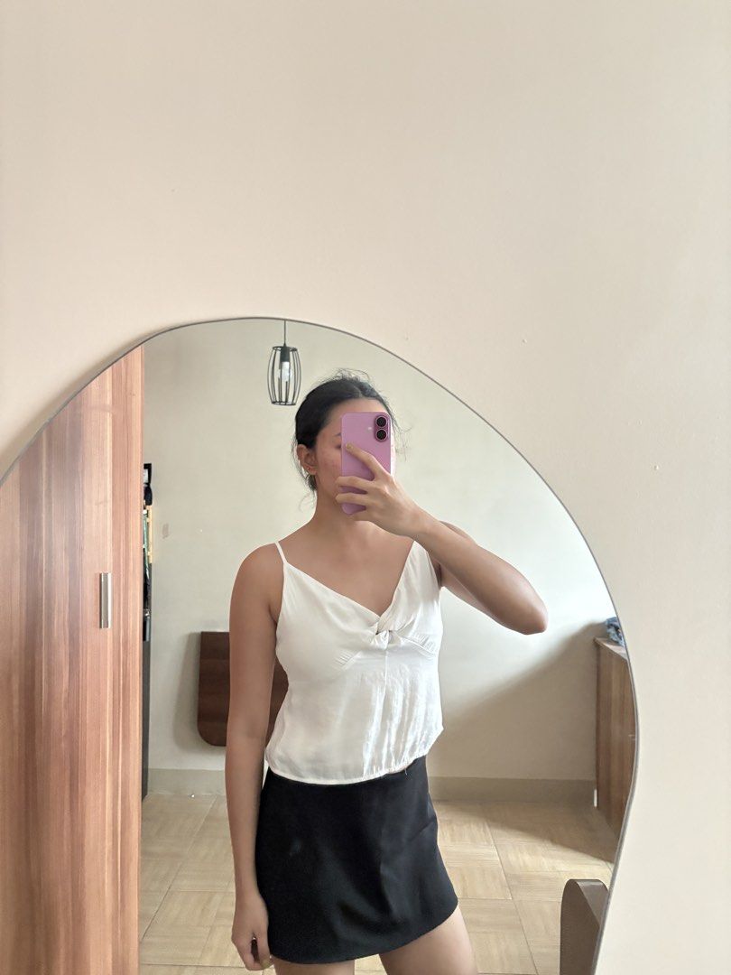 White Cami Top with Knot Detail (Category: Sleeveless) located in Manila. Submitted by _foryou (Listing ID 1446938052, Image 2). Description: - Cute white cami top - Features a stylish knot detail in the front - Delicate spaghetti straps - Lightweight and breathable, ideal for warm weather - Versatile: pairs perfectly with skirts or jeans - Easy to dress up or down for any occasion.