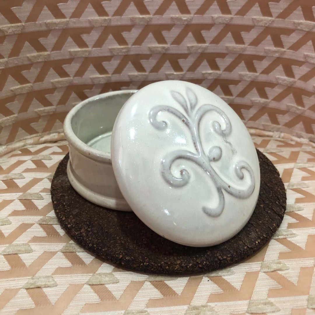 White Ceramic Trinket Box with Embossed Design (Category: Other Home Decor) located in Davao. Submitted by giftopia (Listing ID 1447022897, Image 2). Description: 6 pcs available - Adorable white ceramic box with embossed design on the lid. - Ideal for storing small jewelry, trinkets, or keepsakes - Adds a touch of elegance to any dresser or vanity. - Compact size: approximately 3 inches in diameter..