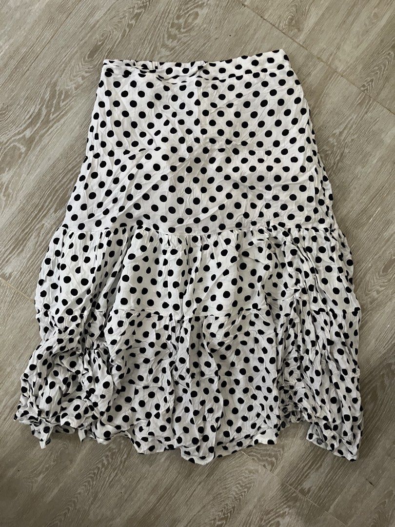 White Polka Dot Midi Skirt (Category: Skirts) located in Manila. Submitted by steve_maddenbootzzz (Listing ID 1446987921, Image 1). Description: - small to medium - White midi skirt - Black polka dot pattern - Tiered, ruffled hem - Flowy fabric - Versatile for casual or dressy occasions - Easy to style with basic tops - Fun and playful addition to your wardrobe.