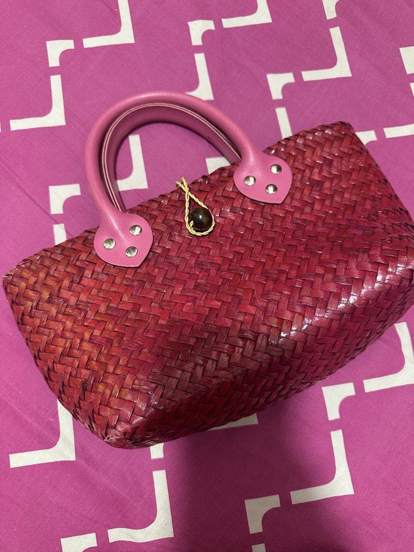 Woven Straw Handbag with Pink Leather Handles (Category: Shoulder Bags) located in Puchong. Submitted by fashion_food_store (Listing ID 1446959792, Image 1). Description: - Cute woven straw handbag - Deep red color - Pink leather handles with silver stud details - Main compartment with an inner zippered pocket - Small decorative bead detail on the front closure - Ideal for summer outings or casual wear.