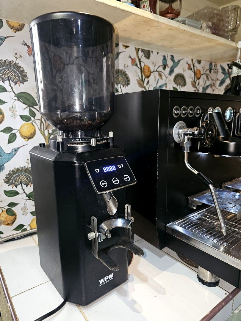 WPM Espresso Machine and Grinder Set (Category: Coffee Machines & Makers) located in Manila. Submitted by kcobach56626 (Listing ID 1447054533, Image 3). Description: - WPM Espresso Machine (Black) - Two Group Heads - Steam Wand - WPM Grinder (Black) - Digital Display - Ideal for coffee lovers - Ready for a new home This well loved coffee machine has been carefully maintained and is in excellent working condition. Feel free to inspect and test it 