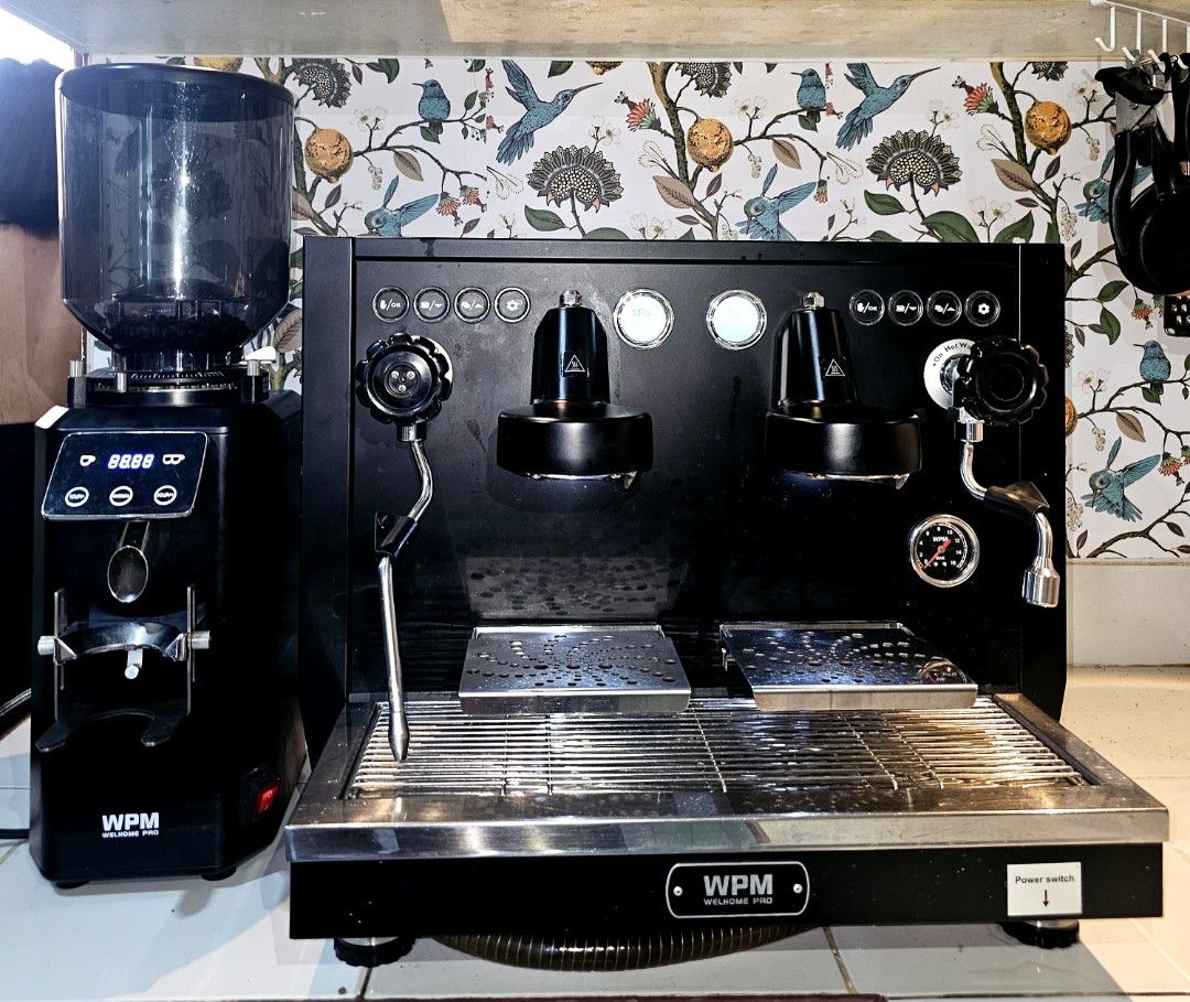 WPM Espresso Machine and Grinder Set (Category: Coffee Machines & Makers) located in Manila. Submitted by kcobach56626 (Listing ID 1447054533, Image 1). Description: - WPM Espresso Machine (Black) - Two Group Heads - Steam Wand - WPM Grinder (Black) - Digital Display - Ideal for coffee lovers - Ready for a new home This well loved coffee machine has been carefully maintained and is in excellent working condition. Feel free to inspect and test it 