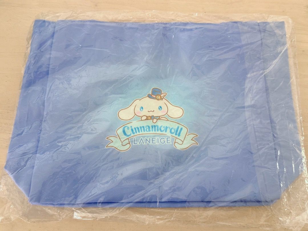 100% AUTHENTIC 100% NEW SANRIO X LANEIGE Cinnamoroll Blue Tote Bag 全新未拆封兰芝×玉桂狗联名托特包 三丽鸥Cinnamoroll双面印花手提袋 (Category: Tote Bags) located in Kuala Lumpur. Submitted by chungfs (Listing ID 1448751250, Image 2). Description: *100% AUTHENTIC 100% NEW *Manufactured by LANEIGE *Under the License of SANRIO WAVE HONG KONG - Brand: Laneige X Sanrio - Cute blue tote bag featuring Cinnamoroll and little bottle designs. - Adorable Cinnamoroll graphic on the f