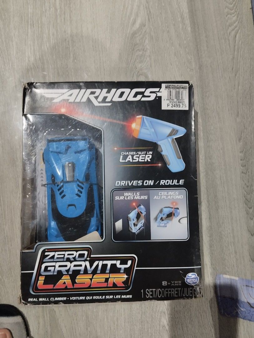 Air Hogs Zero Gravity Laser Real Wall Climber Toy (Category: Action & Battle Toys) located in Antipolo. Submitted by PickClickShip (Listing ID 1448808393, Image 3). Description: - Blue Air Hogs Zero Gravity Laser Car - Drives on walls, ceilings, and the ground - Comes with a laser controller - Exciting gravity-defying fun for kids and adults - open box, but car still intact on inner box - not played.
