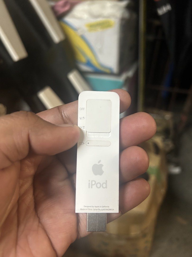 Apple iPod Shuffle 1GB White with Accessories (Category: Portable Music Players) located in Manila. Submitted by giancarlo_13 (Listing ID 1448754119, Image 3). Description: - Apple iPod Shuffle (1st Generation) - Color: White - Storage: 1GB - Includes: Original Earbuds, Charging Dock, Protective Case - Bonus Items: Hair Straightener, Black Carrying Pouch - Ideal for portable music listening.